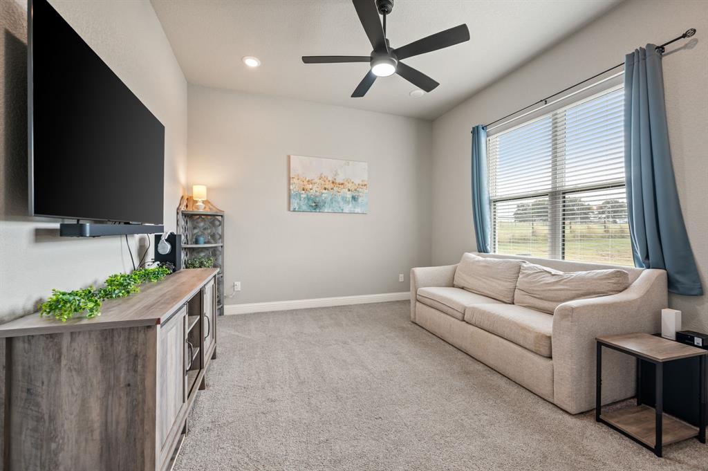175 County Road 1109 Decatur, TX 76234 - Photo 22 of 39 a living room with furniture and a flat screen tv