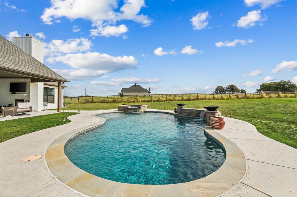 175 County Road 1109 Decatur, TX 76234 - Photo 28 of 39 a view of a swimming pool with lounge chair