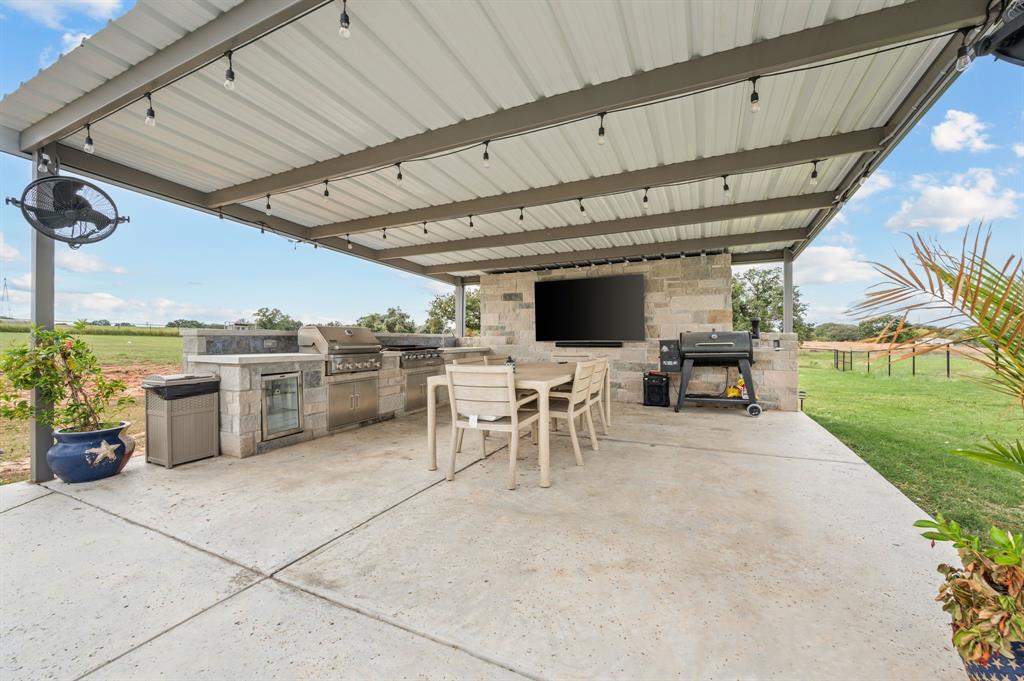 175 County Road 1109 Decatur, TX 76234 - Photo 29 of 39 a view of a patio with table and chairs