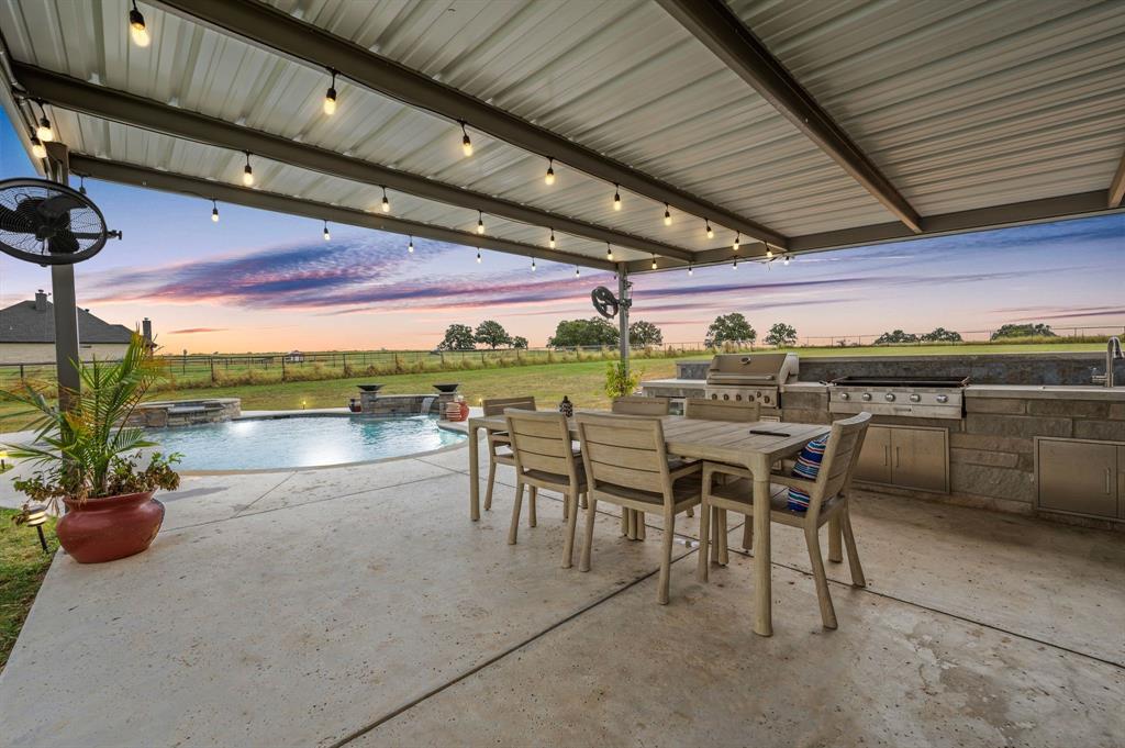 175 County Road 1109 Decatur, TX 76234 - Photo 30 of 39 a patio with a table and chairs