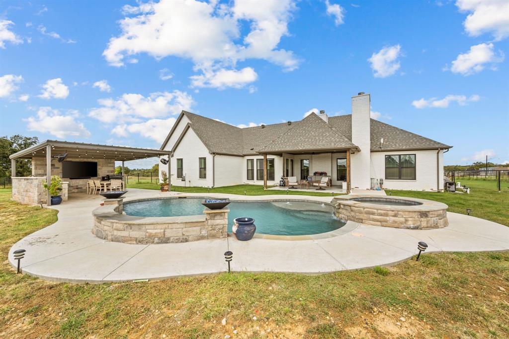 175 County Road 1109 Decatur, TX 76234 - Photo 32 of 39 a view of a house with swimming pool and sitting area