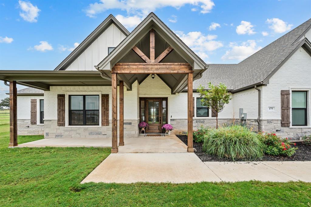 175 County Road 1109 Decatur, TX 76234 - Photo 6 of 39 a front view of a house with a yard