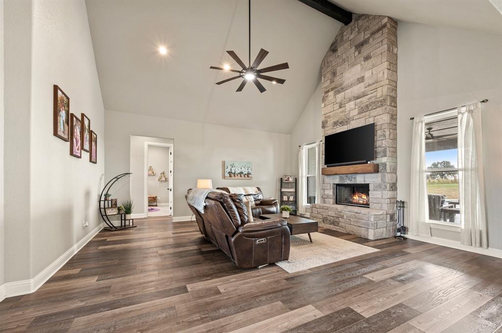 175 County Road 1109 Decatur, TX 76234 - Photo 9 of 39 a living room with furniture and a fireplace
