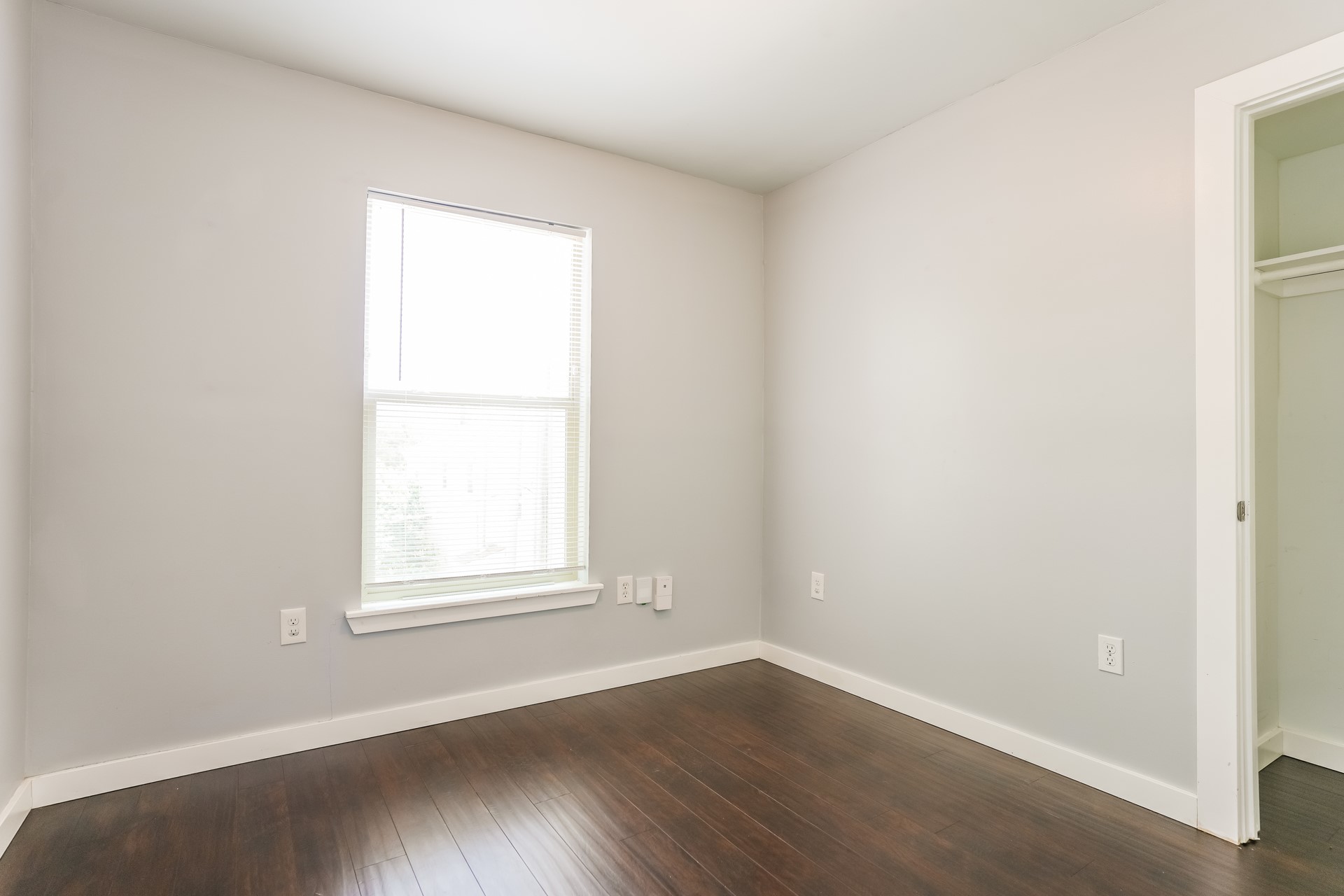 4801 Avenue H Austin, TX 78751 - Photo 9 of 16 Unfurnished bedroom with dark wood finished floors and baseboards