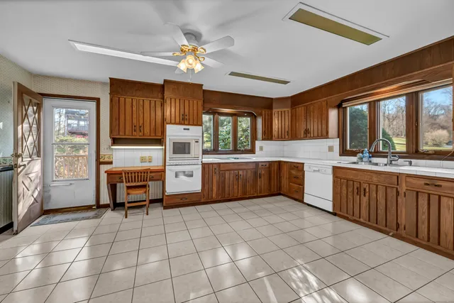 a kitchen with stainless steel appliances a stove sink and cabinets