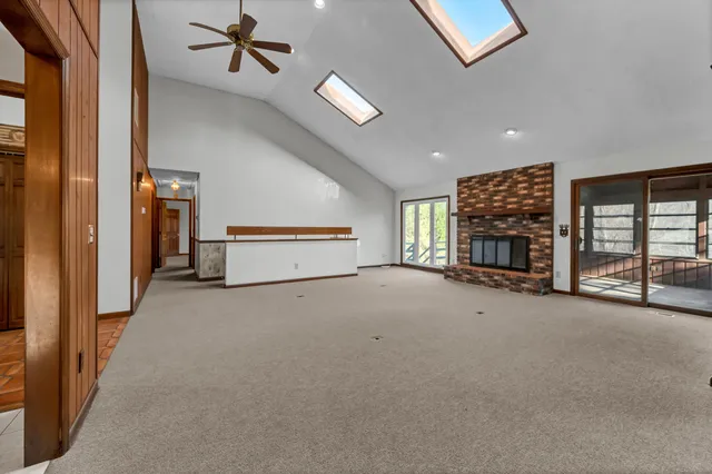 a view of an empty room and closet area
