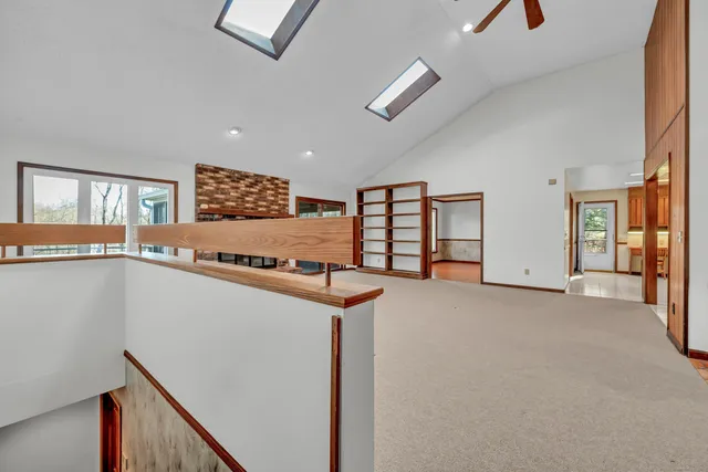 a view of an entryway with wooden floor