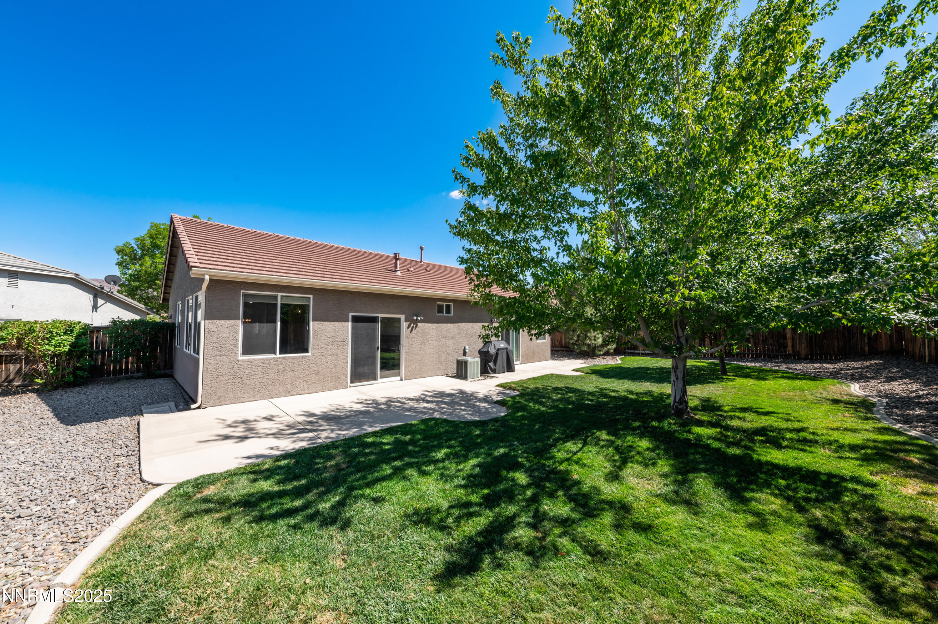 9578 Rusty Nail Court Reno, NV 89521 - Photo 27 of 38 a house view with a sitting space and garden