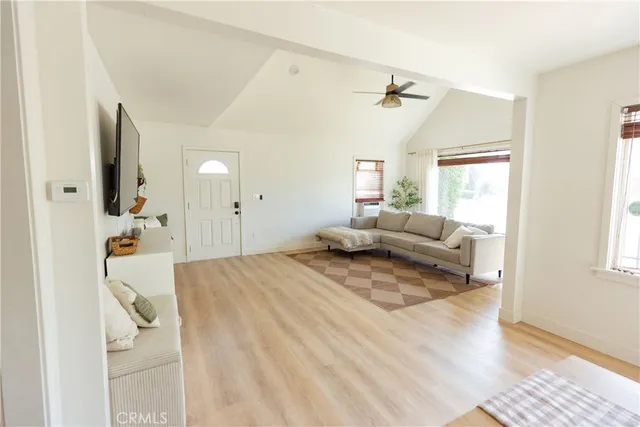 a spacious bedroom with a bed and a window