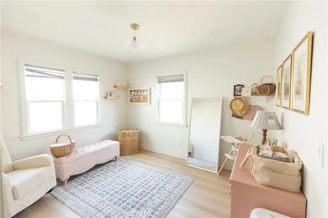 a bedroom with furniture and a rug