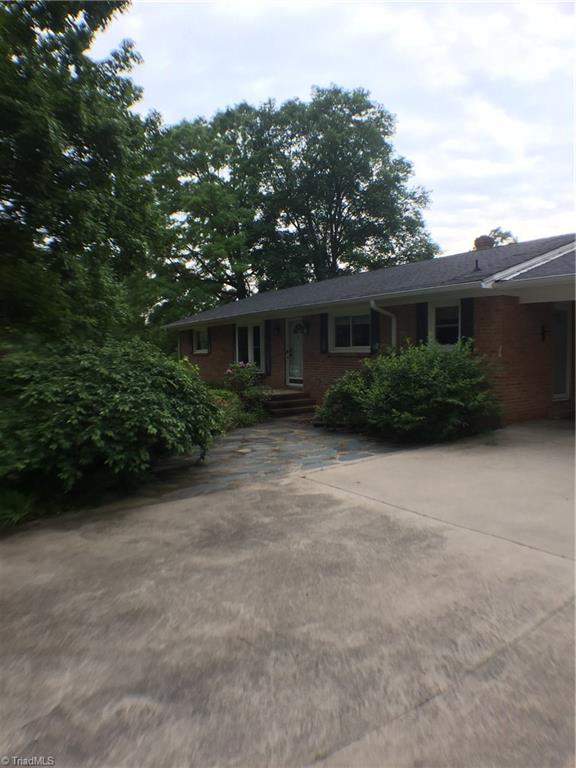 310 McCoy Road Reidsville, NC 27320 - Photo 13 of 19 Front of house with lots of greenery