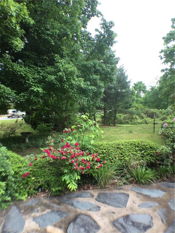 310 McCoy Road Reidsville, NC 27320 - Photo 14 of 19 front yard with lots of trees, flowers and plants
