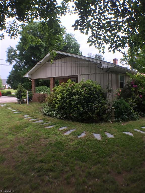 310 McCoy Road Reidsville, NC 27320 - Photo 17 of 19 side of house with nice stone walkway to patio at the back