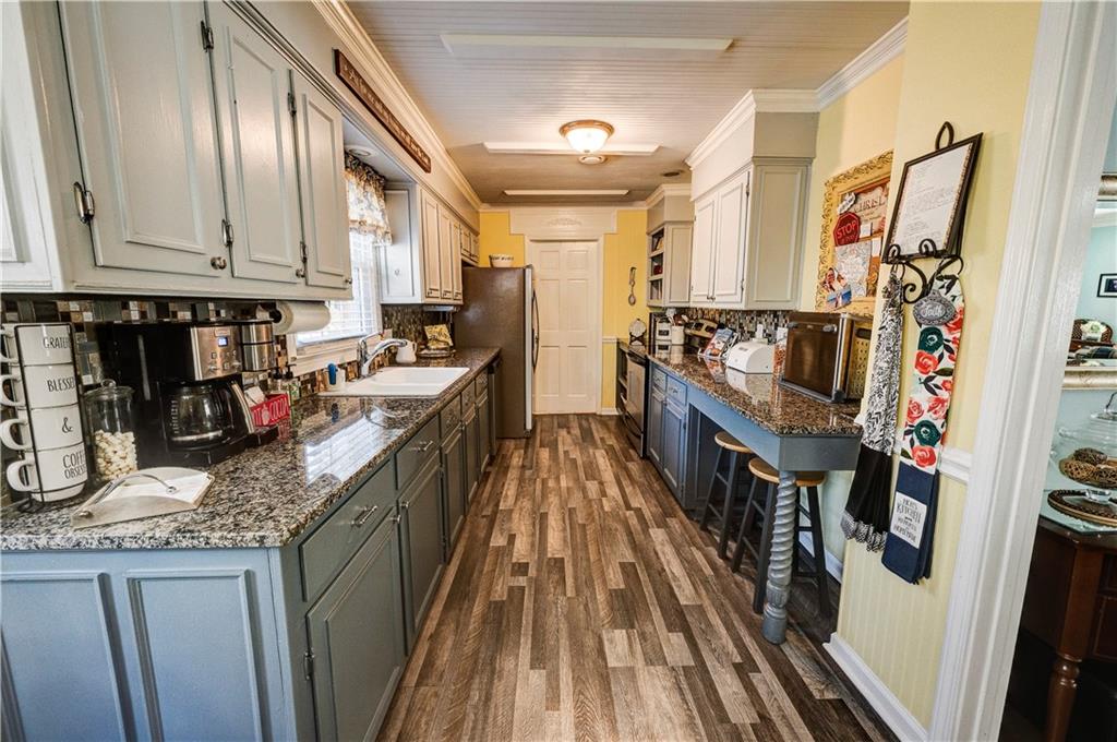651 Camelot Circle Northwest Calhoun, GA 30701 - Photo 18 of 56 a kitchen with stainless steel appliances granite countertop lots of counter top space