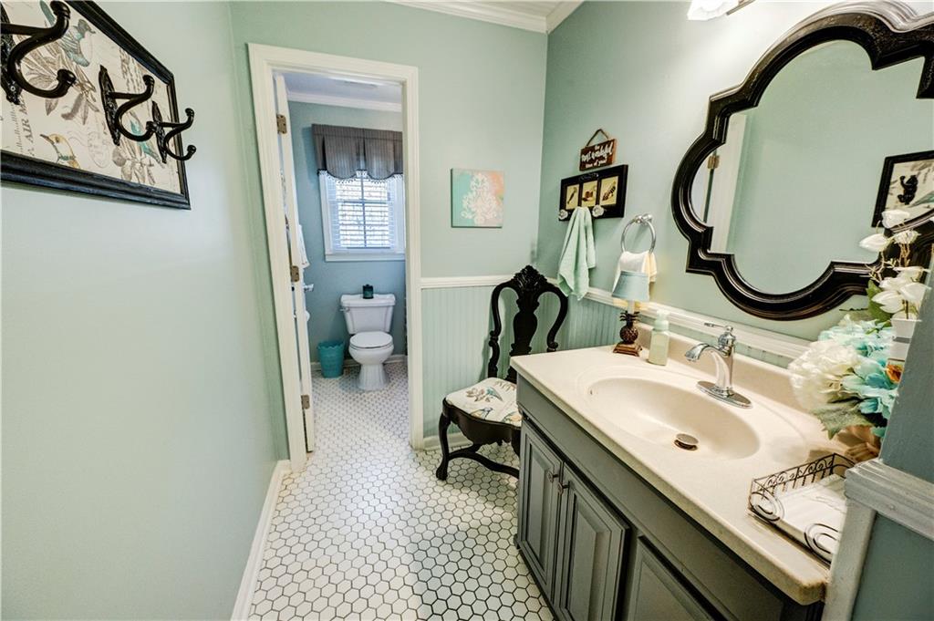 651 Camelot Circle Northwest Calhoun, GA 30701 - Photo 28 of 56 a bathroom with a sink and a mirror