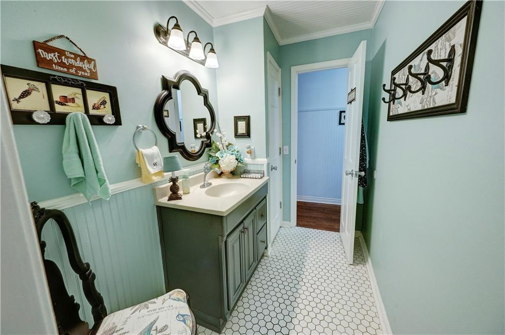 651 Camelot Circle Northwest Calhoun, GA 30701 - Photo 31 of 56 a bathroom with a sink and a mirror