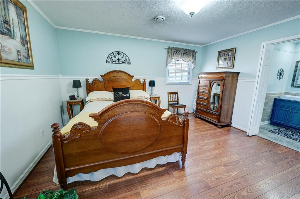 651 Camelot Circle Northwest Calhoun, GA 30701 - Photo 33 of 56 a room with furniture and a mirror