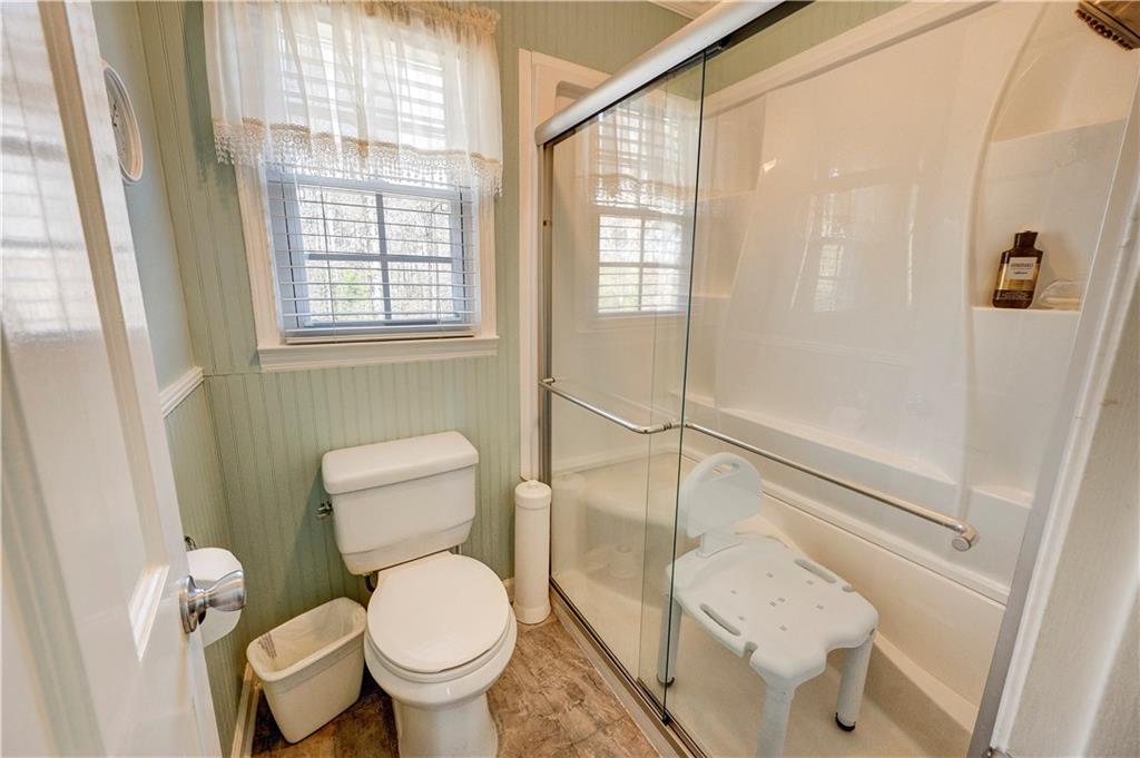 651 Camelot Circle Northwest Calhoun, GA 30701 - Photo 36 of 56 a white toilet sitting next to a bathroom sink and tub