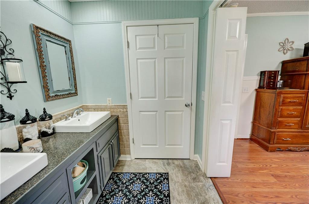 651 Camelot Circle Northwest Calhoun, GA 30701 - Photo 37 of 56 a room with mirror and furniture