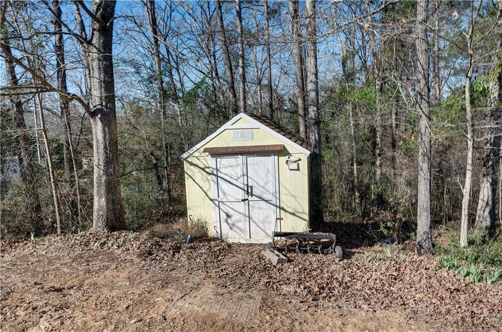 651 Camelot Circle Northwest Calhoun, GA 30701 - Photo 46 of 56 a front view of a house with garden