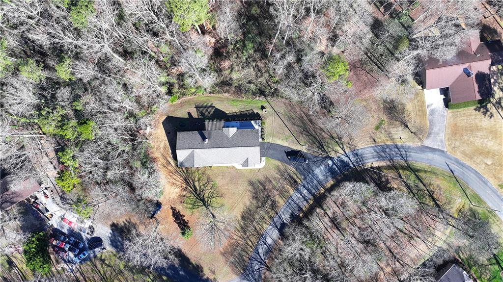 651 Camelot Circle Northwest Calhoun, GA 30701 - Photo 51 of 56 a front view of a house with a yard