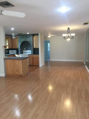 22368 Southwest 57th Circle Boca Raton, FL 33428 - Photo 8 of 41 a view of a kitchen with a sink and a refrigerator
