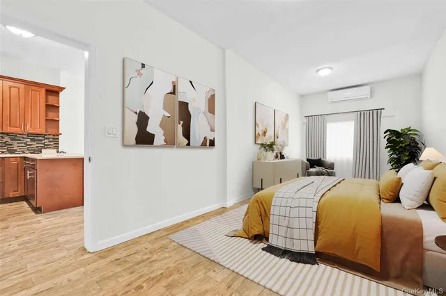 a bedroom with a large bed and a window