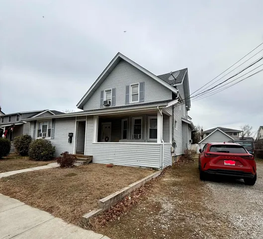 a car parked in front of a house