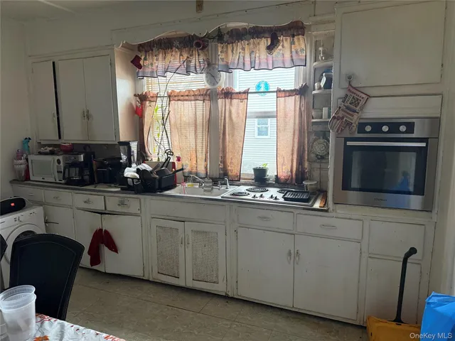 a kitchen with stainless steel appliances a sink and a stove