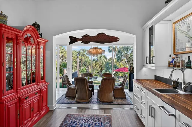 a view of a balcony with wooden floor and bench