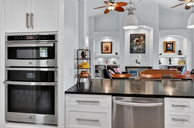 a view of a dining room with furniture wooden floor and chandelier