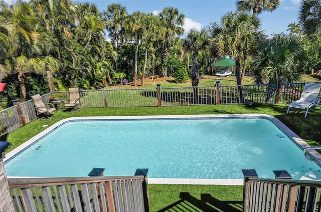 a kitchen view of a stove and a wooden floors