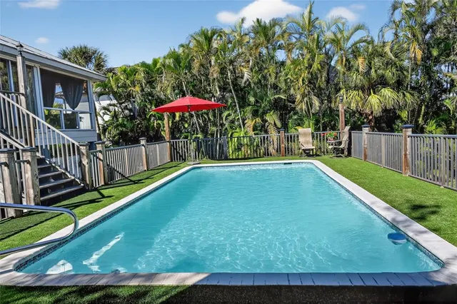 a bedroom with a bed a lamp and window