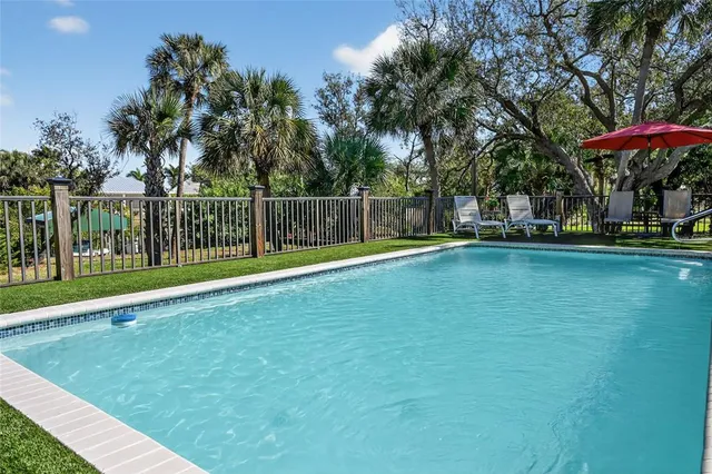 a bed room with a bed and a television