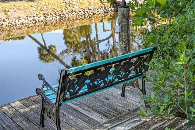 a view of outdoor sitting area with furniture and garden