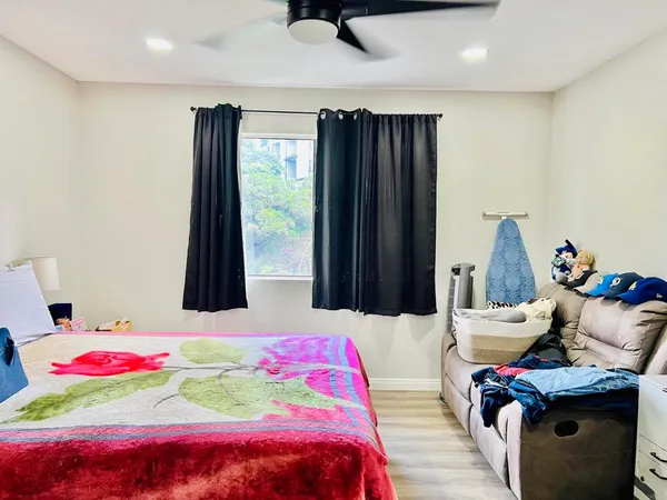a bedroom with a bed and a dresser