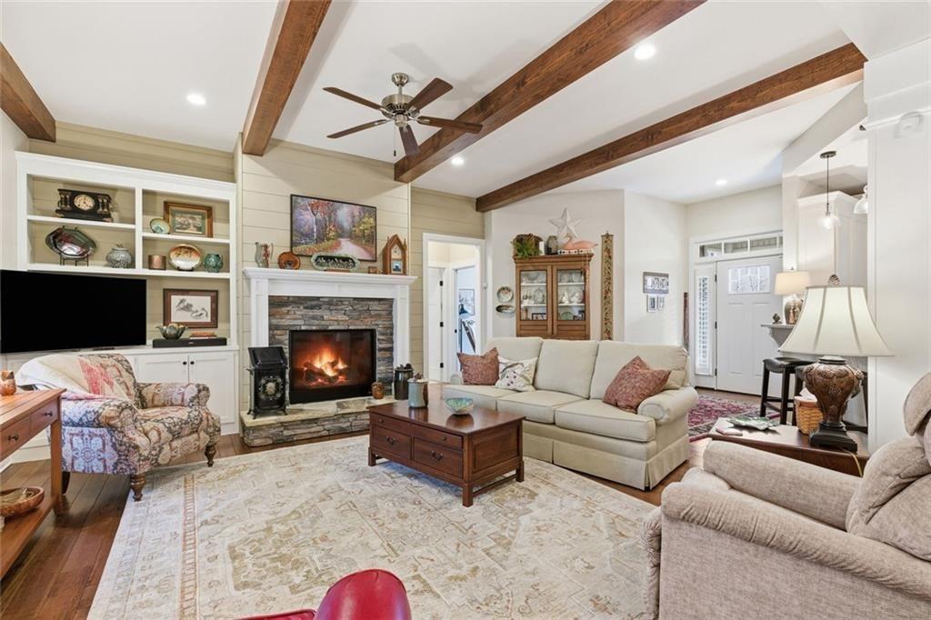 7671 Fern Lane Lula, GA 30554 - Photo 11 of 67 a living room with furniture and a fireplace