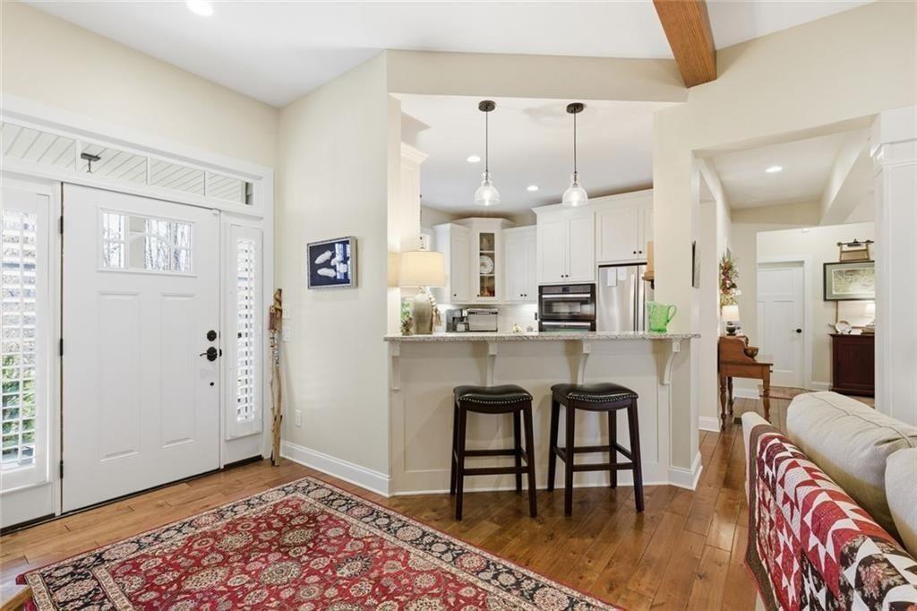 7671 Fern Lane Lula, GA 30554 - Photo 15 of 67 a kitchen with stainless steel appliances granite countertop a refrigerator and microwave