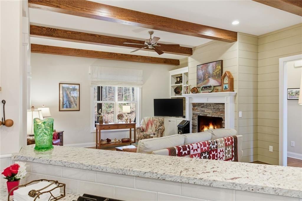 7671 Fern Lane Lula, GA 30554 - Photo 20 of 67 a bedroom with furniture a fireplace and flat screen tv