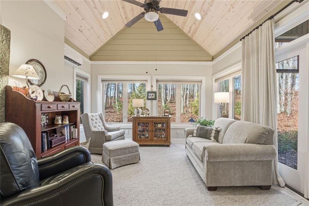 7671 Fern Lane Lula, GA 30554 - Photo 22 of 67 a living room with furniture fireplace and a large window