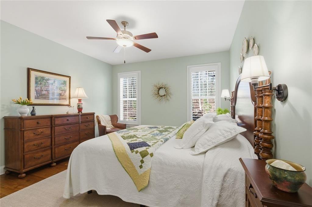7671 Fern Lane Lula, GA 30554 - Photo 23 of 67 a bedroom with a bed and wooden floor