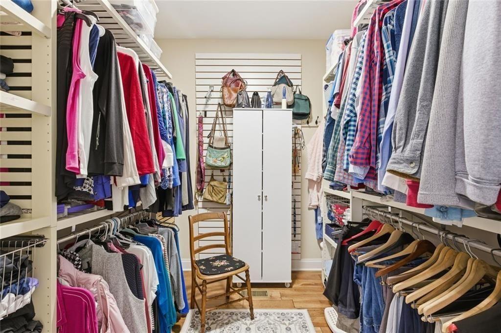 7671 Fern Lane Lula, GA 30554 - Photo 31 of 67 a view of walk in closet with clothes and shoes