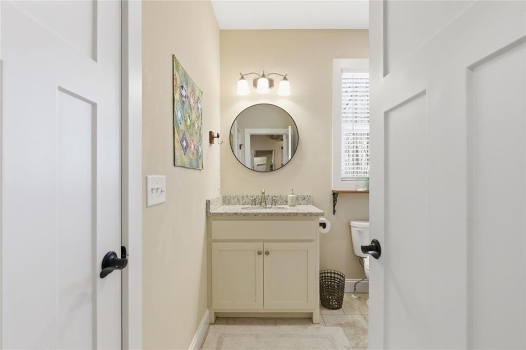 7671 Fern Lane Lula, GA 30554 - Photo 35 of 67 a bathroom with a sink and a mirror