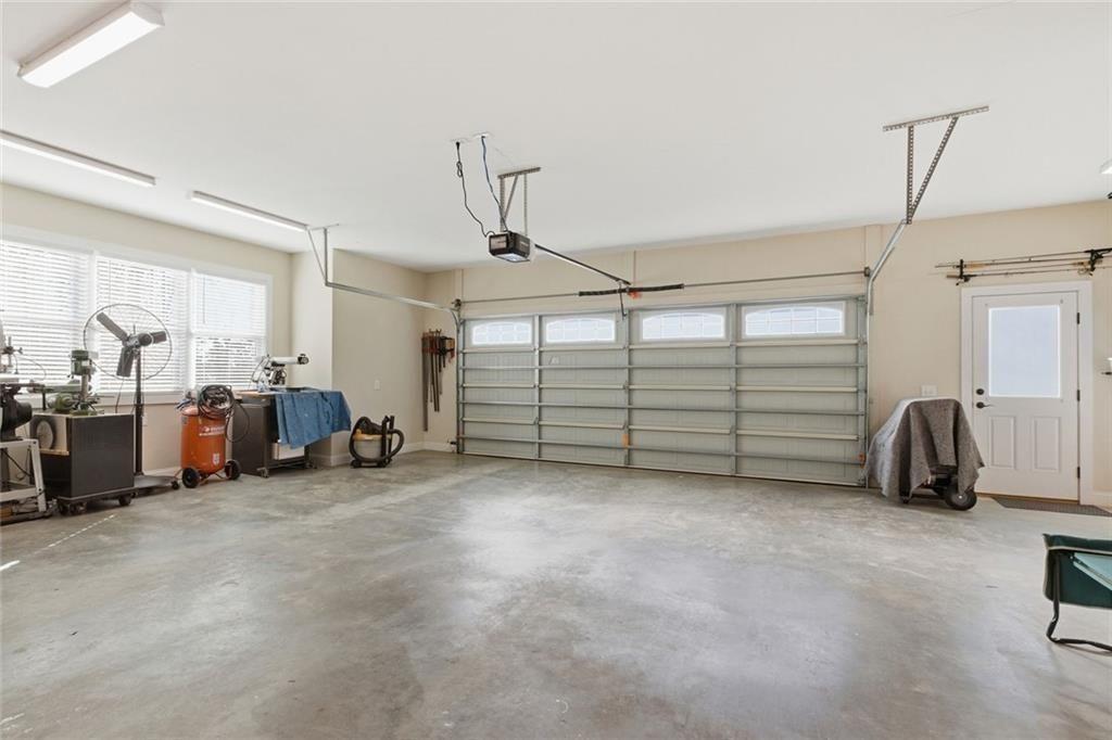 7671 Fern Lane Lula, GA 30554 - Photo 44 of 67 a view of a livingroom with gym equipment and a window