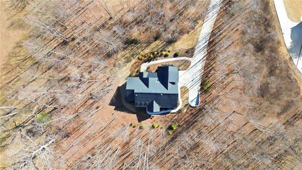 7671 Fern Lane Lula, GA 30554 - Photo 55 of 67 a view of a house with a yard