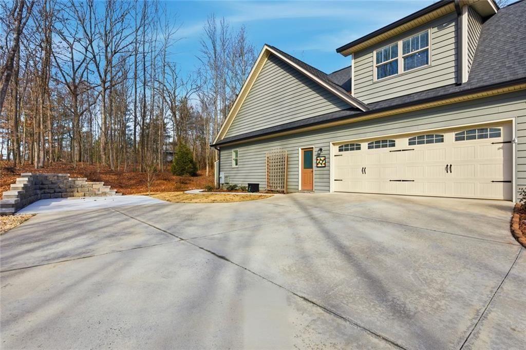 7671 Fern Lane Lula, GA 30554 - Photo 63 of 67 a view of garage with a yard