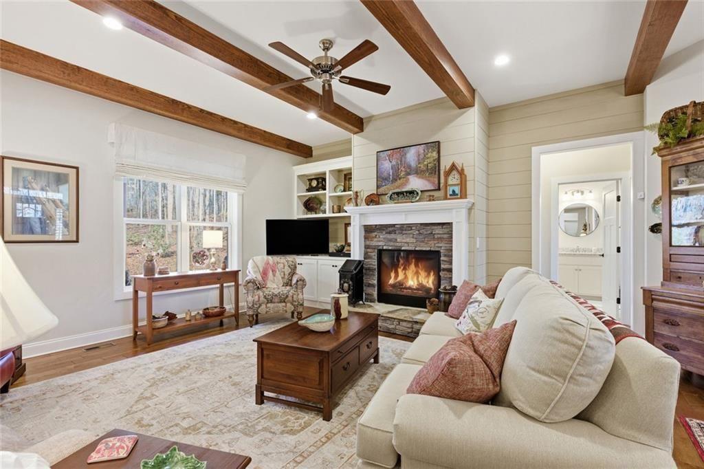 7671 Fern Lane Lula, GA 30554 - Photo 9 of 67 a living room with furniture and a fireplace