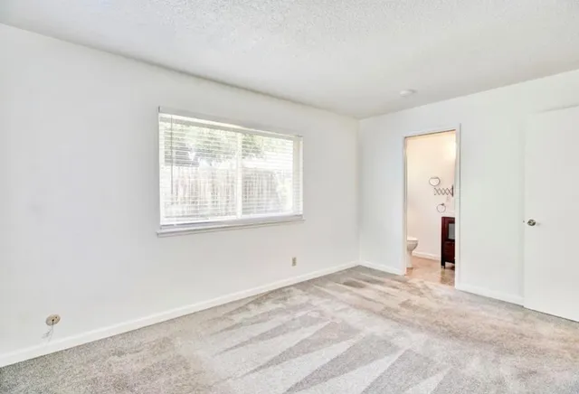 a bathroom with a sink mirror and vanity