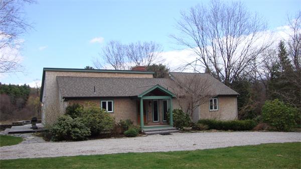 99 Concord Road Wayland, MA 01778 - Photo 1 of 12 a view of house with a yard and potted plants