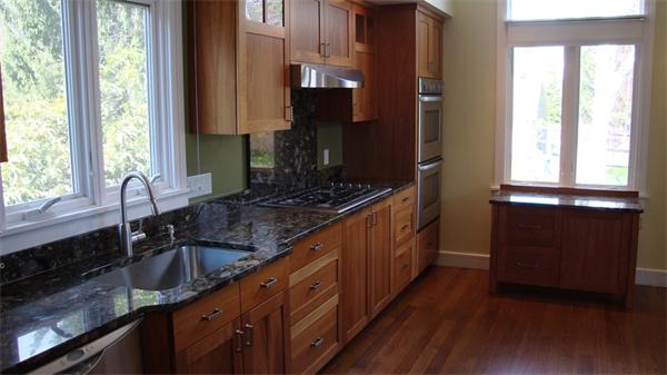 99 Concord Road Wayland, MA 01778 - Photo 11 of 12 a kitchen with sink a window and cabinets